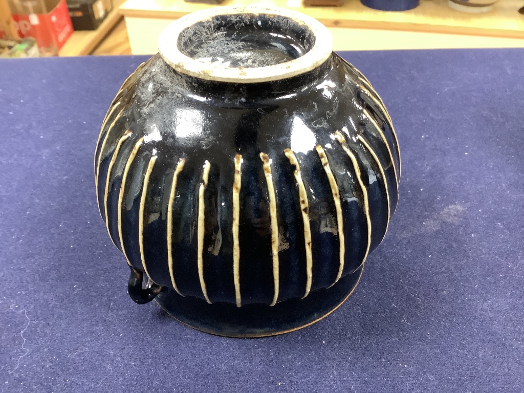 A Chinese blackware ribbed jar, a small blackware vase and a russet and black glazed jar, Yuan dynasty or later